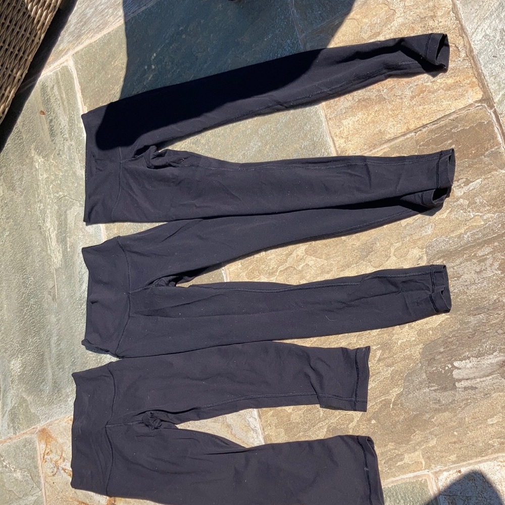 3 pairs of Lululemons. 1 size 4 (Capri) 2 are 4